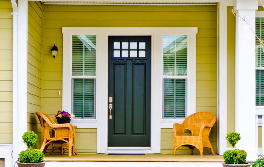 black insulated entry door with windows and covered porch